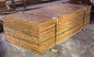 Bundled reclaimed plywood sheets processed for reuse by Sledge Seattle